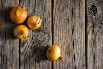 onions on weathered wooden table background