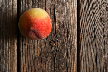 peach fruit on old weathered wooden table background