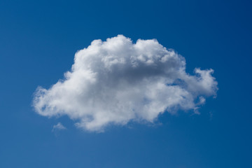 One white cloud against blue sky. Weather forecast.