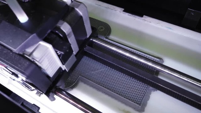 Automatic three dimensional 3d printer performs product creation. Modern 3D printing can halp to make prototype..