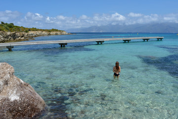 Young woman in Plage du Lotu (Loto beach), Desert des Agriates. Corsica island, France