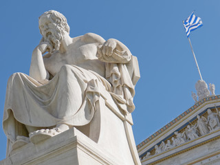 Socrates the ancient philosopher and greek flag with vibrant blue sky background