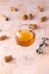 White wine in a glass. The concept of winemaking. Place under your text. Still life on a textural background.