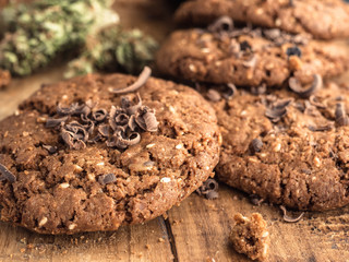 textured chocolate hemp oatmeal cookies on a wooden board