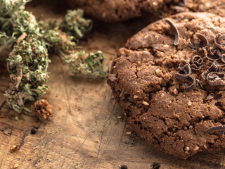 textured chocolate hemp oatmeal cookies on a wooden board