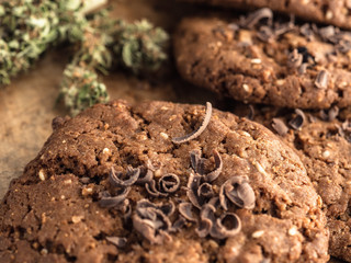 textured chocolate hemp oatmeal cookies on a wooden board