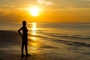 Fototapeta premium Sunrise silhouette lady