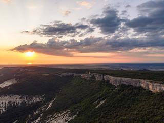 Fototapeta na wymiar the sun is on the horizon. Green mountains. Crimea