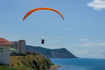 flying over the sea on a paraglider sports vacation in the resort of Anapa