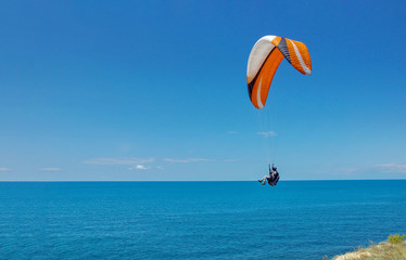 flying over the sea on a paraglider sports vacation in the resort of Anapa