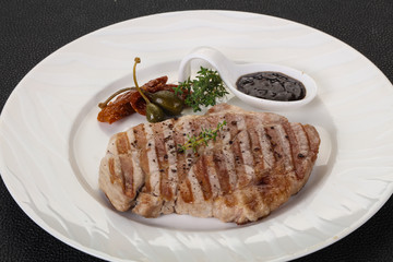Grilled pork steak with pepper sauce