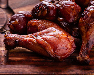 A Pile of Smoked Barbecue Chicken Drumsticks arranged on a cutting board. - 280721265