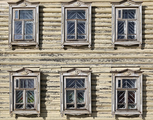 wooden windows with carved platbands.