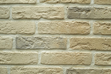 Close up abstract pattern of sandstone brick wall background in vintage tone style and vertical frame,