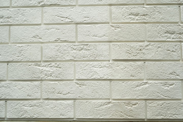 Close up abstract pattern of sandstone brick wall background in vintage tone style and vertical frame,