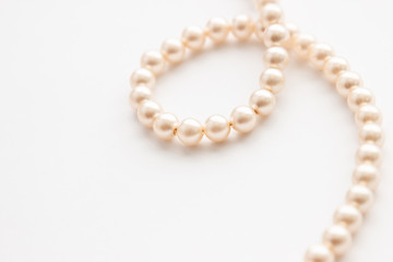Pearls on white background