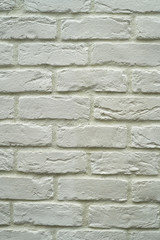 Close up abstract pattern of sandstone brick wall background in vintage tone style and vertical frame,