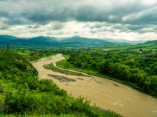 Fototapeta na wymiar Ksani river in Georgia flowing through beautiful valley