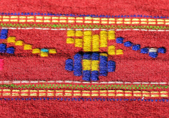 Kosovo, Zvecan, July 16, 2018: Hand made rug, colorful surface, texture of traditional woolen and...