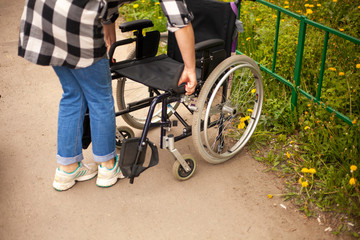 Obraz premium Wheelchair. Armchair for transporting people with disabilities. Medical equipment to make life easier for people with motor disease