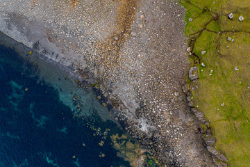Rock beach in Sandoy island - aerial drone view, Faroe Islands