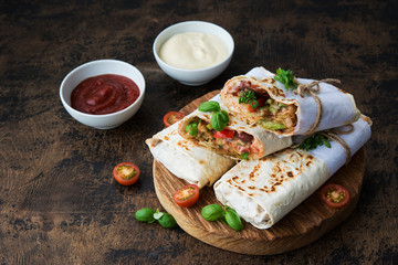 Mexican wrapped burrito with red beans and vegetables