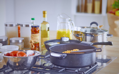 Composition with wooden board and ingredients for cooking on ta