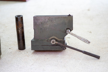 Repair of old metal lathe machine for metalworking closeup in workshop