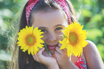 Portrait of a little girl in sunflower