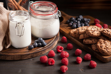Delicious grouped raspberries with tasty chocolate cookies