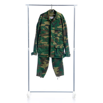 Camouflage Military Clothing On Hanger Rack On White Background Isolation