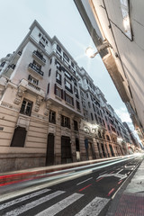 Busy urban street of Alicante. Costa Blanca, Spain, Apr. 2019
