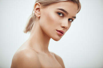 Feeling beautiful. Gorgeous young blonde woman with perfect skin looking at camera while standing...