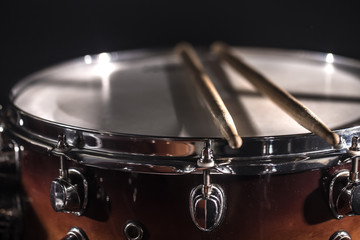 Drum set in a dark room against the backdrop of the spotlight. Atmospheric background symbol of...