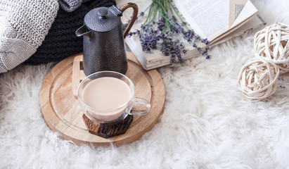 Cozy still life with a kettle and a Cup of hot drink