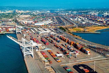 Oakland Harbor port terminal with shipping containers and cranes