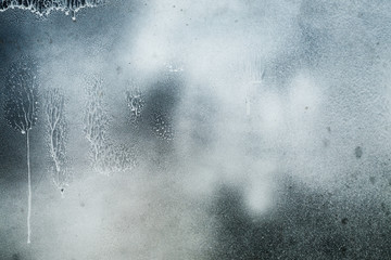 Black and white paint mix on metal surface abstract texture