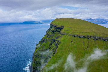 Aerial view of Koltur island in Faroe Islands, North Atlantic Ocean. Photo made by drone from above. Nordic Natural Landscape.