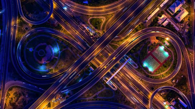4K, Time lapse Traffic at night on expressway, motorway and highway in intersection