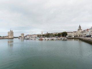 Fototapeta na wymiar La Rochelle. Porte de la grosse horloge le long du Vieux-Port