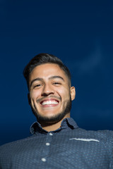 Young man closeup portrait outdoors during twilight