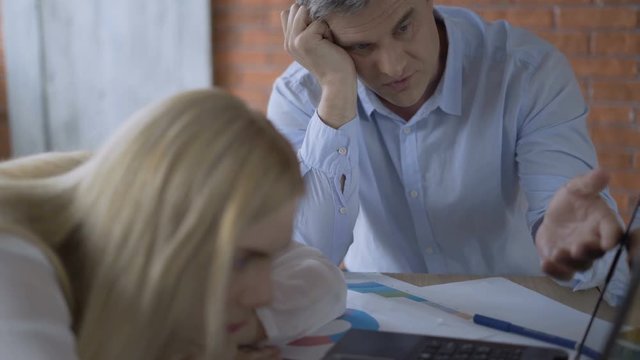 two upset businessmen in the office worry about the future of the company. partners fiasco deal bargain 4K
