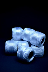 White threads. Knitting thread. Sewing threads.