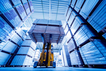 Forklift loader in storage warehouse ship yard. Distribution products. Delivery. Logistics....