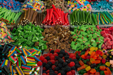Eastern market entourage photography of counter background for selling many colorful sweet candies, unhealthy food picture