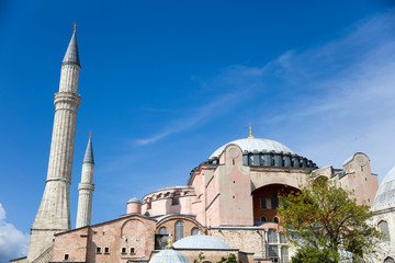 Fototapeta na wymiar Hagia Sophia domes and minarets in the old town of Istanbul, Turkey