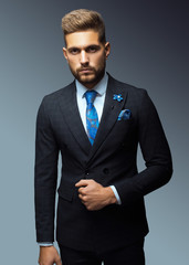 Stylish young man in suit and tie. Business style. Fashionable image. Office worker. Sexy man...