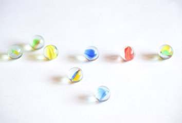 Colorful round glass balls in white background