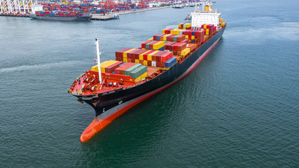 Aerial view container ship carrying container in import export business logistic and transportation...