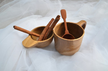 Cups, teaspoons, small cups and coasters made of brown wood
